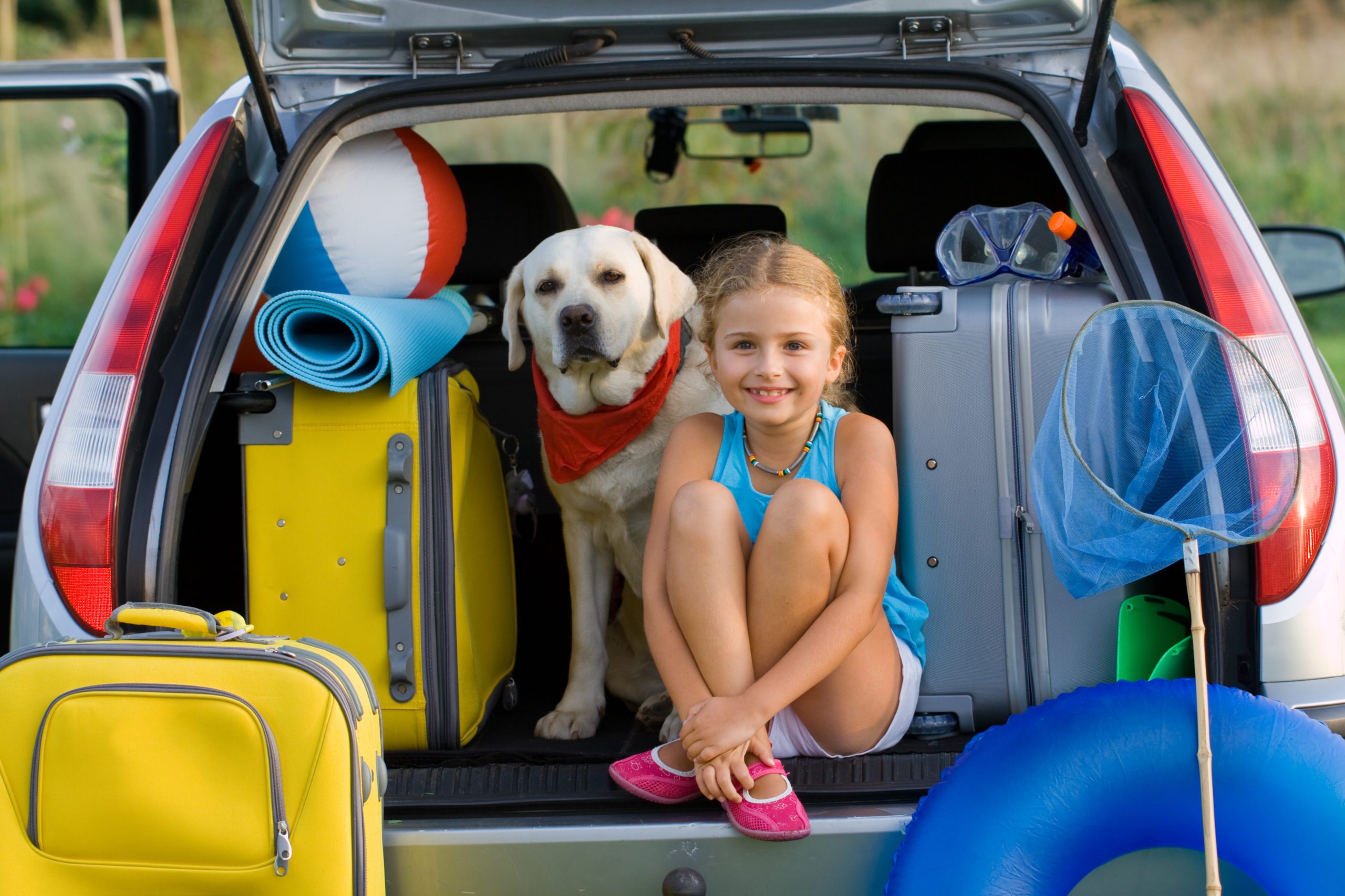 kid and dog packing for camping