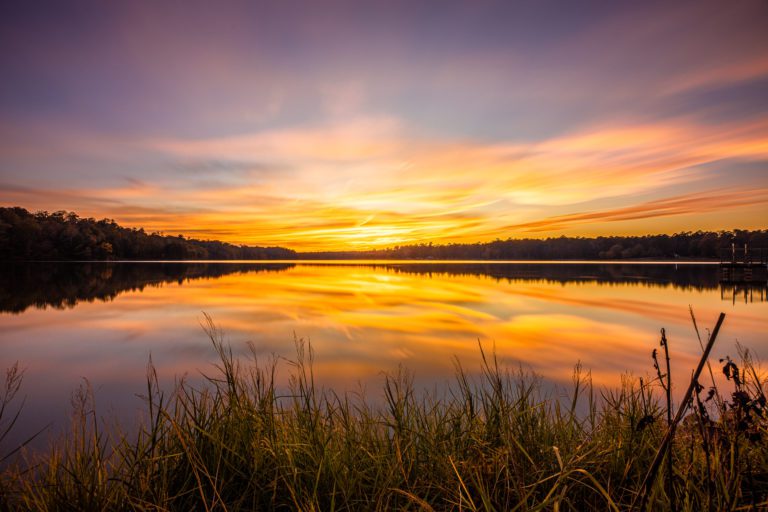 A Sunset At Davis Lake. At the mile post 243 exit on the Natchez Trace and about 4 miles you'll meet this 200 acre lake in Houston Mississippi.Lots of fishing and camping here and a great setting for dramatic sunsets.